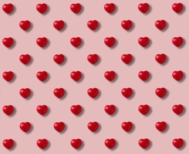 Foto patrón de corazones rojos sobre fondo rosa
