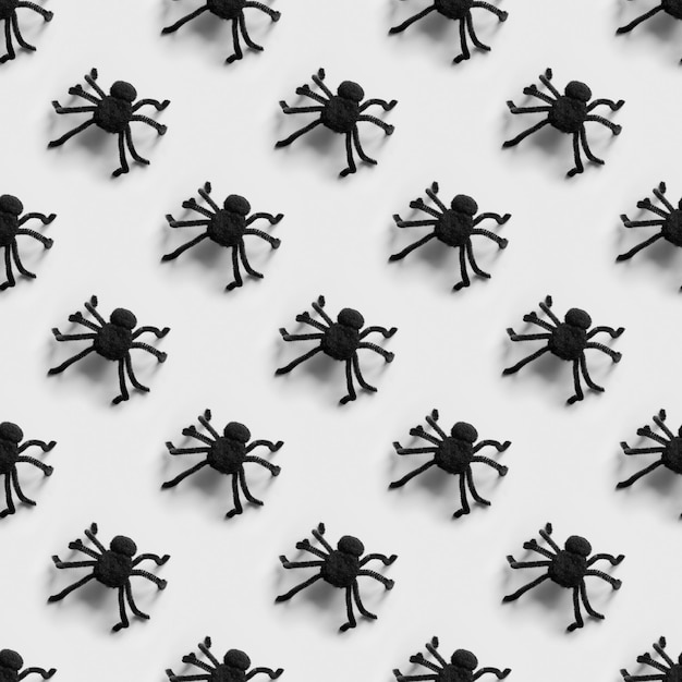 Foto patrón sin fisuras de halloween de muchas arañas negras