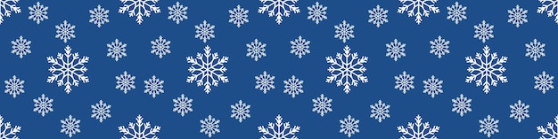 Patrón sin fisuras de Navidad con copos de nieve sobre fondo azul pastel. fondo de banner extra ancho