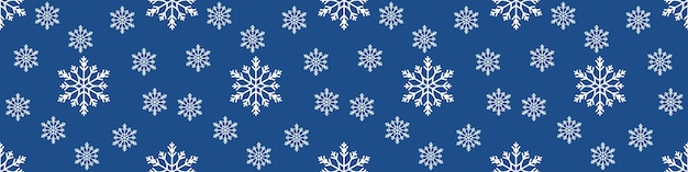 Patrón sin fisuras de Navidad con copos de nieve sobre fondo azul pastel. fondo de banner extra ancho