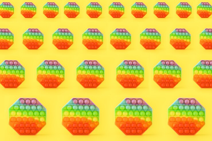 Foto patrón sin fisuras de silicona colorido anti estrés pop it juguete