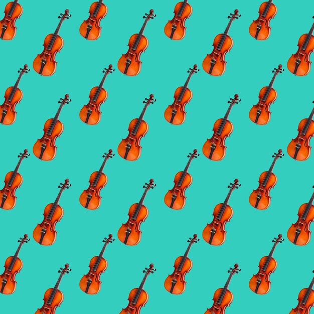 Patrón sin fisuras de violín sobre fondo verde pastel. impresión de violín  | Foto Premium