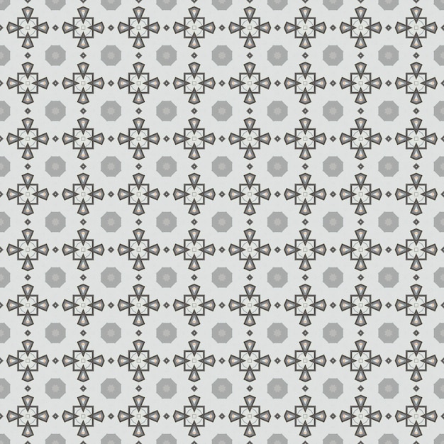 El patrón de las flores en blanco y negro sobre un fondo gris.