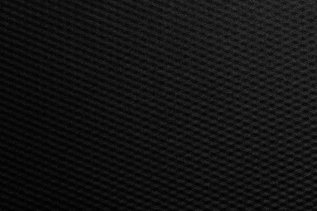 Foto patrón de fondo de textura de metal o plástico negro para el diseño en el fondo de su concepto de trabajo