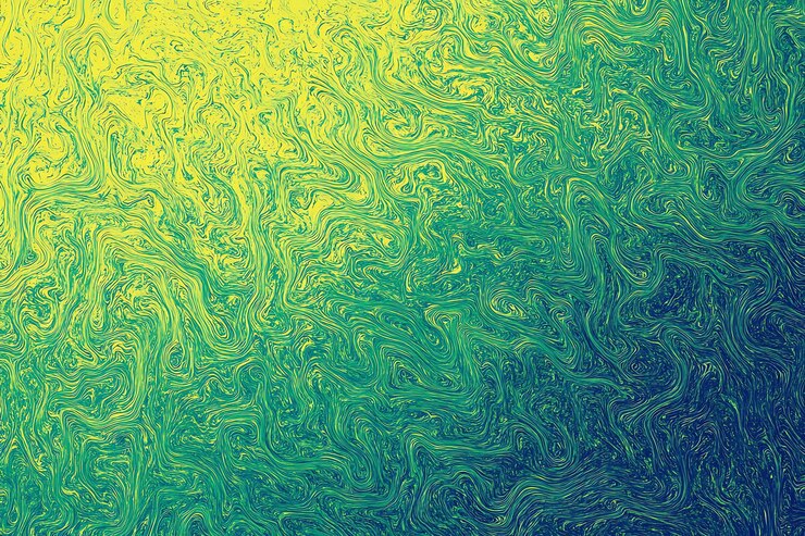 Patrón giratorio abstracto de verde y amarillo