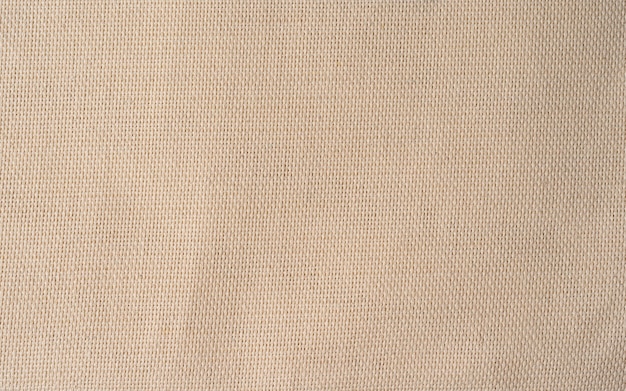 Patrón de lienzo en tono natural. Fondo abstracto y textura para el diseño. Cerca de textiles de lino, fondo beige, textura de la tela en alta resolución