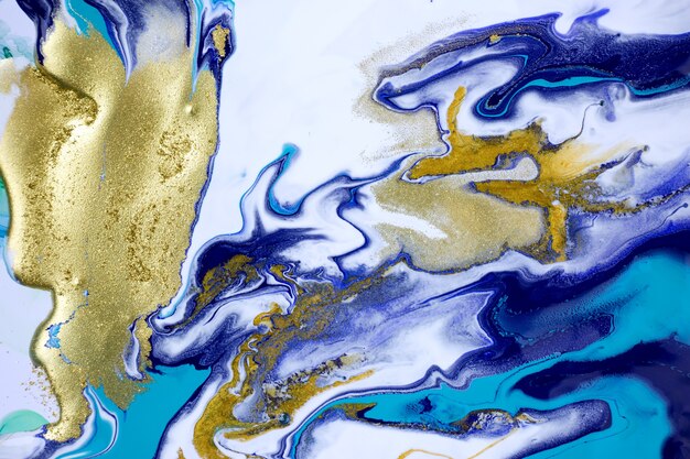 Patrón de mármol líquido de fondo abstracto azul y dorado veteado