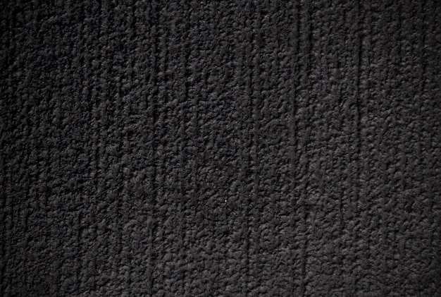 Patrón de rayado horizontal en pintura de color negro de piso de concreto