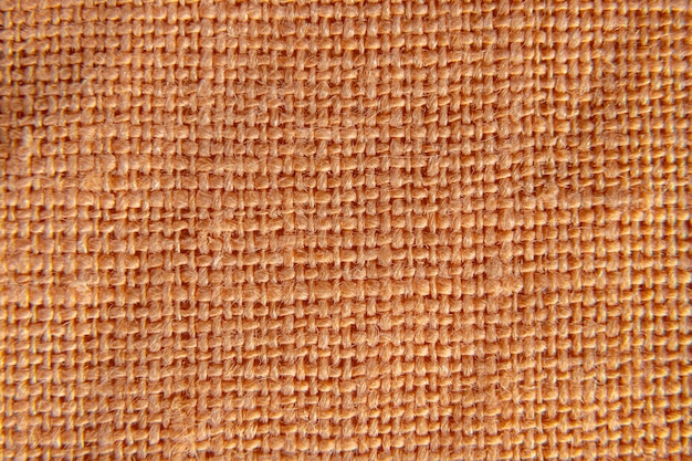 Patrón de tejido de lino naranja o amarillo oscuro. tiro macro