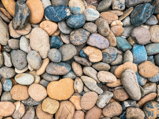 Foto patrón de textura de grava de guijarros y piedras pequeñas en el camino para la decoración interior del jardín