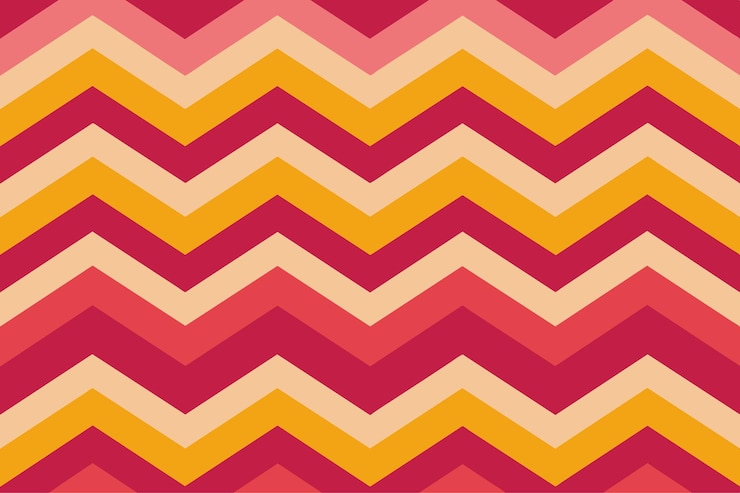 Foto un patrón de zigzag colorido se muestra en un fondo rosa