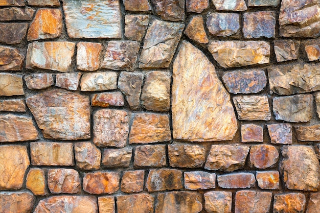 Foto patrones coloridos y texturas de muros de piedra.