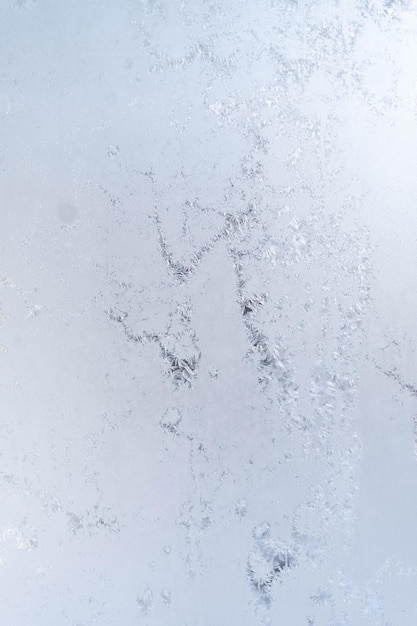 Foto patrones de hielo en vidrio de invierno