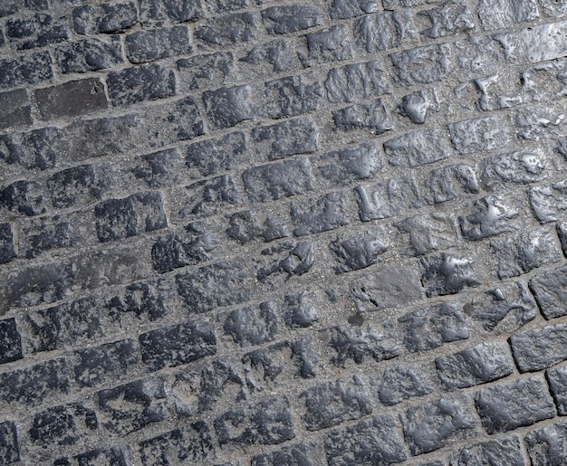 Foto pavimento de paralelepípedos na cidade superfície da rua cobblestone ao pôr-do-sol