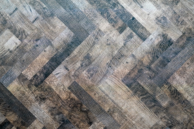 Pavimento em parquet escuro de madeira. Textura de fundo abstrato.