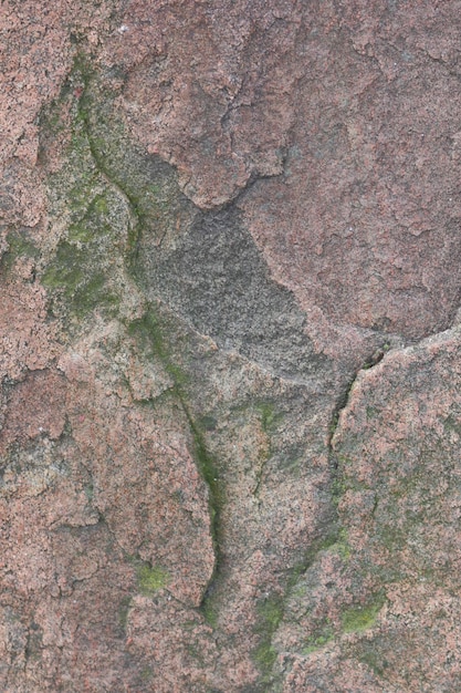 Pedra castanha ou fundo rochoso parede de pedra castanha áspera vista aproximada da superfície texturizada