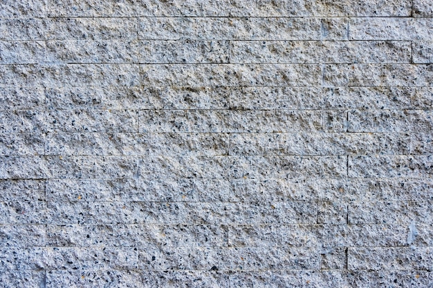 Pedra de granito cinzento e pedra da parede para plano de fundo e textura