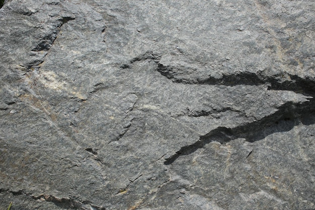 Pedra velha textura poderosa áspera em tela cheia com pequenos detalhes