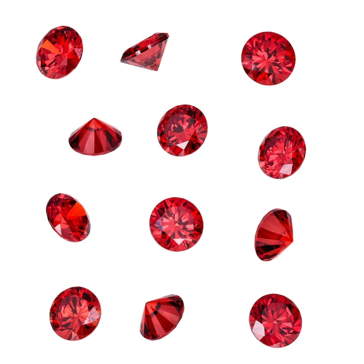 Foto pedras preciosas de rubi vermelho isoladas em fundo branco gemas de joias de luxo