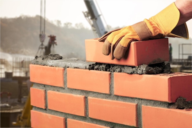 Foto pedreiro, pedreiro de cimento, construtor, trabalhador de casas