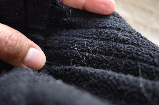 Pelo de gato o pelo de perro en el jersey.