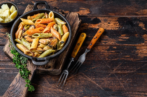 Penne Pasta in Sahnesauce mit Meeresfrüchten.