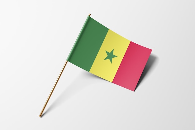 Pequeña bandera de papel de Senegal sobre un fondo blanco