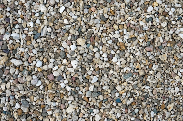 Pequeñas piedras multicolores como fondo. Textura natural abstracta. Patrón de piedras.