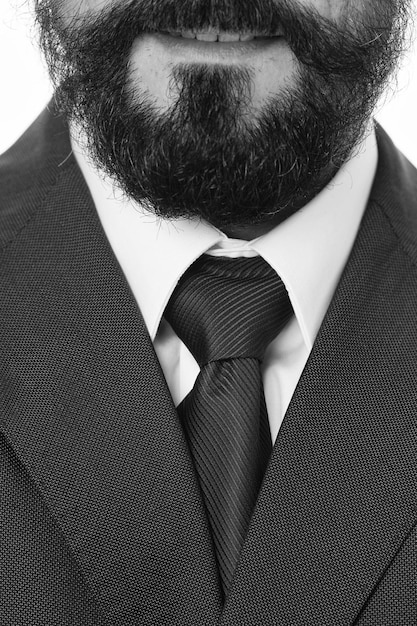 Foto perfeito até o último detalhe terno clássico com gola de camisa branca e gravata elegante estilo de empresário barbudo close-up detalhes elegantes da aparência do homem de negócios código de vestimenta do estilo de negócios