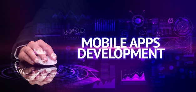 periférico sem fio de mão com inscrição MOBILE APPS DEVELOPMENT conceito de tecnologia moderna