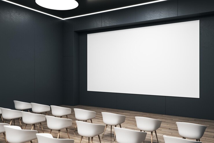 Foto perspektivische ansicht auf leerem weißen bildschirm mit platz für werbetext in leerem auditorium mit weißen stühlen auf holzboden 3d-rendering-mockup