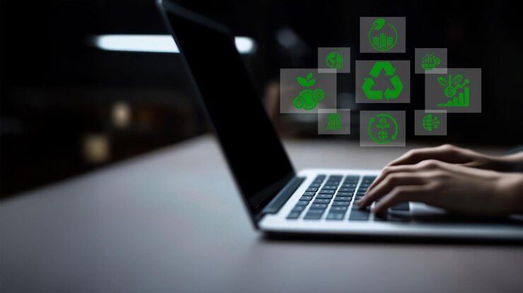 Foto pessoa a digitar num portátil com ícones de iniciativas empresariais verdes a emergir do ecrã destaca ideias ecológicas e trabalhos focados na sustentabilidade