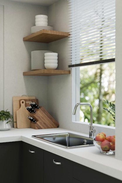 Pia moderna com torneira na mesa da cozinha contra a janela e decoração da cozinha