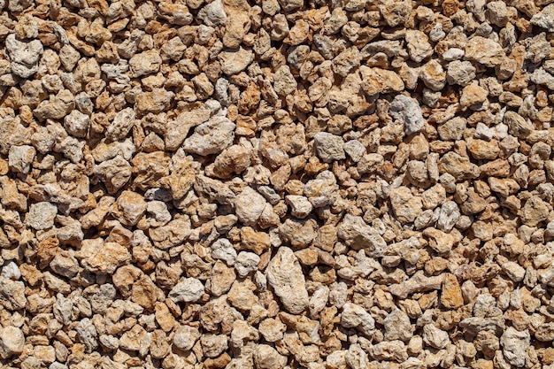Piedras trituradas de rocas sedimentarias primer plano textura uniforme del fondo