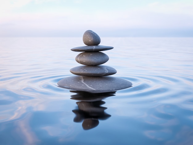 Foto piedras zen equilibradas en agua