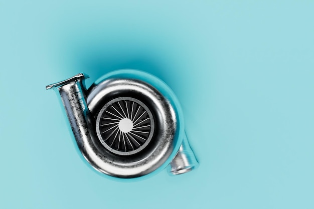 piezas de mantenimiento de automóviles. turbina de coche de aire sobre un fondo turquesa.