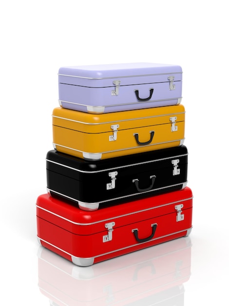 Pila de cuatro maletas de viaje coloridas aisladas en blanco