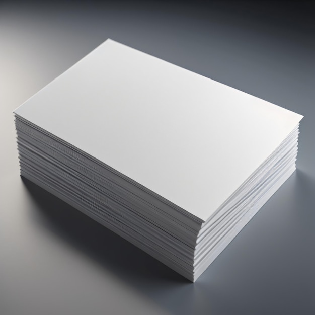 Una pila de papel blanco sobre una superficie gris.