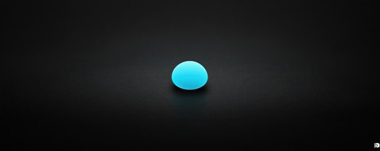 Foto una píldora azul que está en un fondo negro