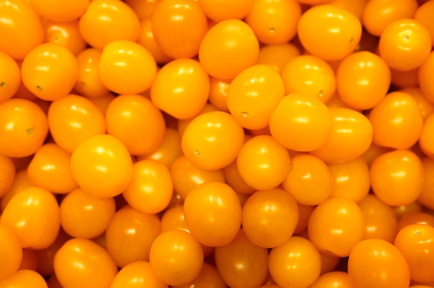 pilha de legumes mini tomate amarelo como pano de fundo