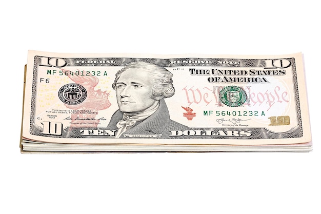 Pilha de notas de dez dólares do fundo da moeda dos Estados Unidos