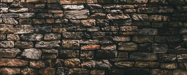 Foto pilha de pedras forma uma parede decorativa