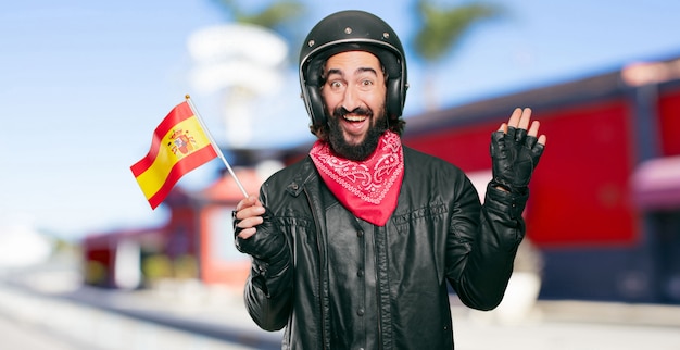 Piloto de moto con bandera de españa.