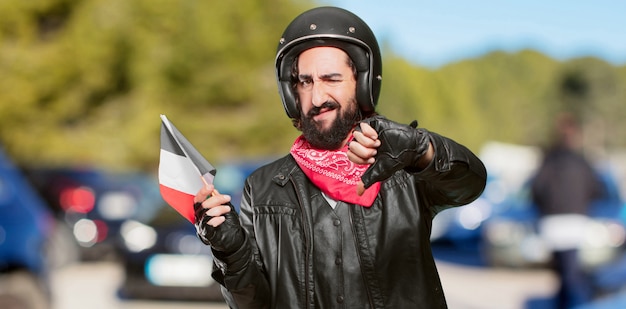 Piloto de motos con bandera de francia.