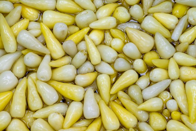 Pimientos en escabeche de cerca Pimientos en escabeche como textura de fondo