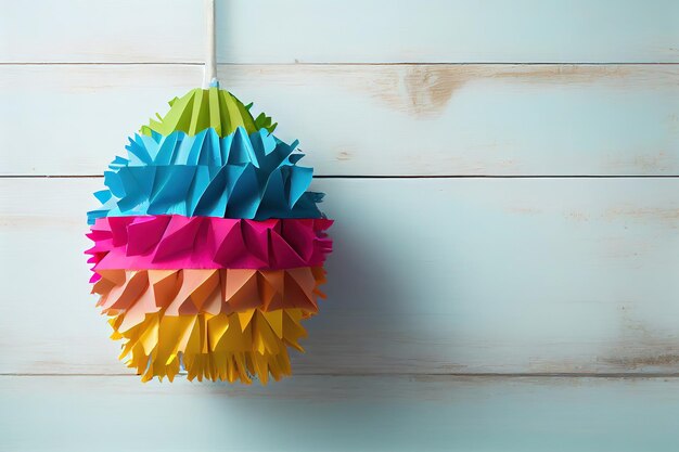 Piñata de papel de colores sobre mesa de madera blanca Generative Ai