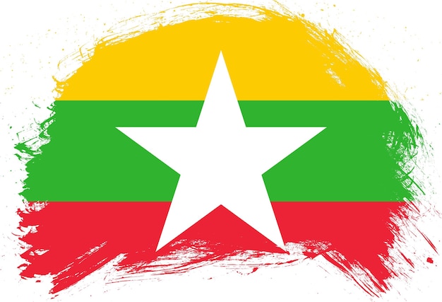 Foto pincel de trazo angustiado bandera pintada de myanmar sobre fondo blanco