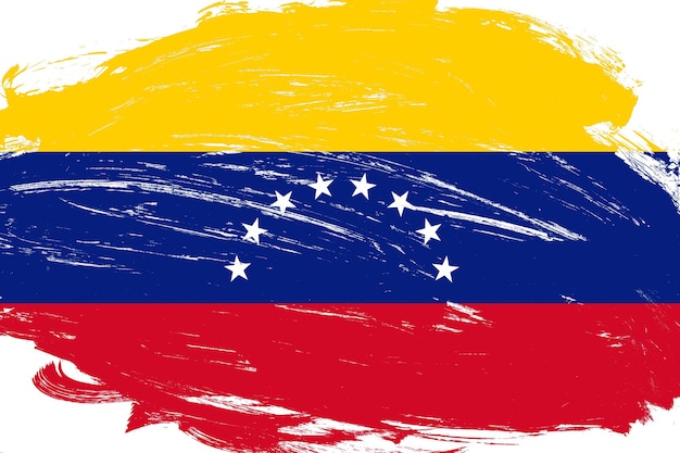 Foto pincel de trazo angustiado pintado bandera de venezuela sobre fondo blanco