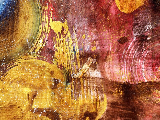 Pincelada oro acrílico pintura fondo abstracto.