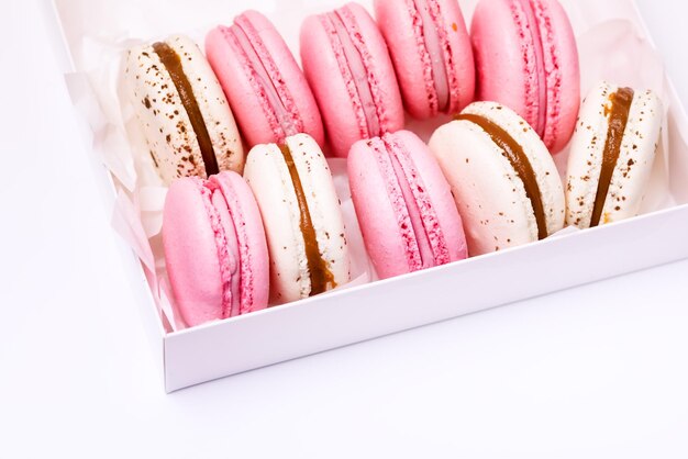 Pink Strawberry and White Caramel and Salt Macarons in Box French Delicate Dessert Pink and White Pastel Macarons